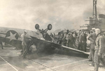 FM-2 Wildcat nosed all the way over on landing aboard training aircraft carrier USS Sable on Lake Michigan, United States, 1944.  Note parked TBF-1 Avengers with bent propeller blades.  Photo 1 of 2.