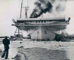 The training aircraft carrier USS Sable in the icy waters of Lake Erie on the day of her commissioning in Buffalo, New York, United States, 8 May 1943.