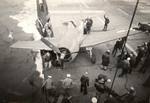 An F6F Hellcat stayed on the flight deck when landing, but dropped a wheel into the catwalks and severely bent the propeller blades aboard the training aircraft carrier USS Sable on Lake Michigan, United States, 1945.