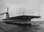 Training aircraft carrier USS Wolverine steams through the Chicago harbor on Lake Michigan, United States, 1942.