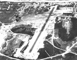 Aerial view looking toward the sea at Bellows Field, Oahu, Hawaii, Oct 27, 1941. The airplanes on the ramp are probably O-47 Observation Aircraft of the 86th Observation Squadron.