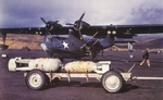 PBY-5 Catalinas from Fleet Air Wing 4 in the Aleutian Islands, Alaska, Jan 11, 1943. Note four Mk-37 aerial depth charges under wings, with two more and one 500-pound general purpose bomb on bomb cart.