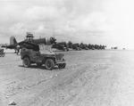 F4U-1D Corsairs of Marine Squadron VMF-312 lined up at Kadena Airfield, Okinawa, Japan, 1945.