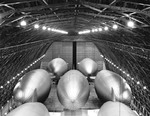 Seven US Navy K-class airships from Airship Patrol Squadron ZP-31 inside one of the two LTA (lighter than air) hangars at NAS Santa Ana, California, United States, 1943.