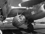 A "patient" being prepared for transport during a drill, 1944. The aircraft is an F-5B Lightning fitted with two drop tanks modified for use in high speed medevac operations