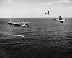 A training flight of TBF-1 Avengers lining up to drop practice torpedoes, late 1942, off the east coast of the United States. Photo 3 of 4.