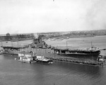 USS Intrepid entering the deperming station at Norfolk, Virginia, United States, 11 Sep 1943. Note the outline of the ship’s waterline painted on the flight deck. Photo 2 of 3.