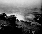 Heavy seas getting heavier as USS Wasp (Essex-class) steams into a typhoon south of Japan, 25 Aug 1945.