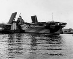 Essex-class Aircraft Carrier Hancock moving past the Fore River Bridge, Quincy, Massachusetts, United States, 14 Apr 1944, the day before her commissioning. Photo 2 of 2