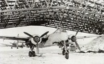 A Heinkel He-219A Uhu night fighter with FuG-220d radar and a Junkers Ju-87 Stuka in the background, Münster-Handorf Airfield, Germany, late 1944.