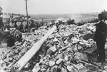 Lidice, Czechoslovakia 10 Jun 1942. SS officer overseeing the destruction of the village. The wreck of St. Martin’s church built in 1732 is still standing in the village center.