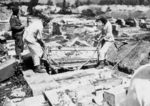 Lidice, Czechoslovakia 10 Jun 1942. The village cemetery in the act of being looted.