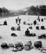 Japanese civilians outside the Imperial Palace near the Nijubashi bridge, Tokyo, Japan, 15 Aug 1945, photo 2 of 2