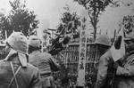 Japanese soldiers burying a unidentified Chinese soldier, date unknown