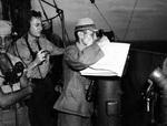 Japanese pilot Lieutenant H. Nomura aboard USS West Virginia to help with the navigation of Tokyo Bay, Japan, 31 Aug 1945