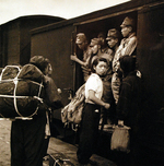 Japanese soldiers and civilians at a train station, Hiroshima, Japan, Sep 1945