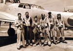 Lieutenant Commander Don Thorburn, Lieutenant Commander E. V. Wedell, interpreter S. Toda, Lieutenant Commander John MacInnes, Lieutenant W. V. ballow, and Lieutenant Commander Cliff McDowell at Atsugi Airfield, Japan, 28 Aug 1945