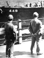 Japanese Navy personnel preparing to be transported aboard USS Missouri, 27 Aug 1945; note USS Nicholas in background