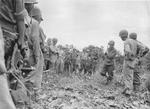 Lieutenant General Joseph Stilwell speaking with US and Chinese officers, Myitkyina, Burma, 18 Jul 1944, photo 2 of 2