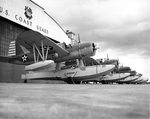 United States Coast Guard OS2U-3 Kingfishers armed with aerial depth charges preparing for a convoy escort flight from Coast Guard Air Station Salem, Massachusetts, United States, early 1942.