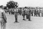 Colonel William E. Bergen reading medal citations while Lieutenant General Joseph Stilwell and Major General F. C. Sibert looked on, India, mid-1942