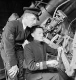 Chinese Navy Lieutenant (jg) Sung Chang-Chin receiving instructions at the Chatham Gunnery School, England, United Kingdom, Aug 1945