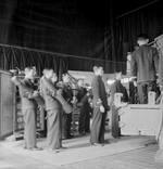 Chinese junior officers receiving instructions on loading a twin 4-inch gun, Chatham Gunnery School, England, United Kingdom, Aug 1945, photo 2 of 2