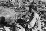 Chinese civilian in a destroyed village, 1930s