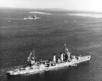 USS Tuscaloosa in Scapa Flow, Scotland, United Kingdom while she was operating with the British Home Fleet, April 1942. The British heavy cruiser HMS London is in the background.