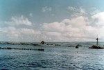 Battleship USS West Virginia, sunk in the Pearl Harbor Attack 7 Dec 1941 and then given temporary repairs at Pearl Harbor, is about to leave Hawaii for further repairs in the United States, 30 Apr 1943. Photo 3 of 3.