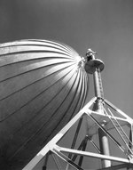 A sailor securing a K-class airship to a mooring mast at Moffett Field, San Jose, California, United States, Feb 1944.