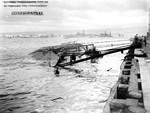 Minelayer USS Oglala remains capsized and sunk at Pearl Harbor’s Ten-Ten Dock after being torpedoed in the 7 Dec 1941 Japanese air attack. 9 Dec 1941 photo. Note the fires are out on Battleship Row.