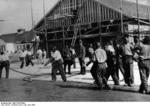 SS guards overseeing prisoners, Dachau Concentration Camp, Germany, 28 Jun 1938