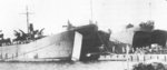 HMS LST-324 and HMS LST-412 unloading logs at Freetown, Sierra Leone, circa mid-1943