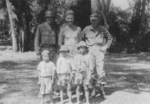 Men of 613th Field Artillery Battalion, US 5332nd Brigade (Provisional) with local children, Burma, 1945, photo 1 of 2; Captain Rolf Larson, Bill Hale, and Holger Munson