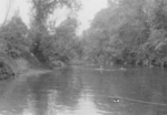 Man of 613th Field Artillery Battalion, US 5332nd Brigade (Provisional) in a river, Burma, Apr 1945