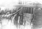 Members of US 5332nd Brigade (Provisional) building quarters for its colonel with locals, Burma, 1945, photo 2 of 4