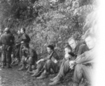 Members of US 5332nd Brigade (Provisional) Bob Compton and Lieutenant Pat Murphy (nearest camera) at rest with members of US 124th Cavalry Regiment, Burma, 1945