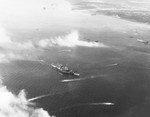 Cruiser USS Honolulu beached in Leyte Gulf off Dulag City, Leyte, Philippines, 21 Oct 1944 making temporary repairs after being torpedoed the previous day.