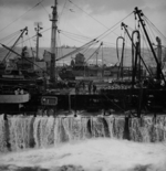 USS New Jersey being refueled in rough post-storm condition, date unknown, photo 1 of 3