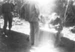 Bill Hale of US 5332nd Brigade (Provisional) issuing pay, Nalong, Kachin, Burma, 24 Dec 1944