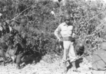 Major Gus Edwards supervising men of C Battery of US 5332nd Brigade (Provisional) during firing exercise, Camp Landis, Kachin, northern Burma, Dec 1944