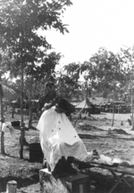 Haircut of a man of US 5332nd Brigade (Provisional), Camp Landis, Kachin, northern Burma, Dec 1944