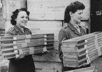 Members of the Auxiliary Territorial Service carrying recently arrived rifles made by the American firm Winchester, Britain, 1940s