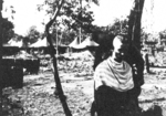 John Blackburn giving Captain Rolf Larson a haircut, Camp Landis, Kachin, northern Burma, Dec 1944; they were both of US 5332nd Brigade (Provisional)