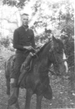 Captain Rolf Larson of US 5332nd Brigade (Provisional) atop a horse at the Shweli River bivouac, Kachin, Burma, Jan 1945