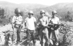 Jake Rand, A. K. Bartlow, Okie, and George Beal of US 5332nd Brigade (Provisional), Burma, 13 Feb 1945; note 75mm howitzer in background