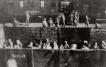 An open rail carriage carrying Jewish prisoners, Warsaw, Poland, 1944.