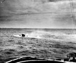 View from United States Coast Guard cutter Spencer as she approached U-175 after being forced to the surface by depth charges and just before U-175 sank, North Atlantic, 500 nautical miles WSW of Ireland, 17 Apr 1943.