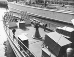 United States Coast Guard cutter WPC-372 in New York Harbor, spring 1942. Note Mousetrap anti-submarine rocket rails on her foredeck. Photo 1 of 3.